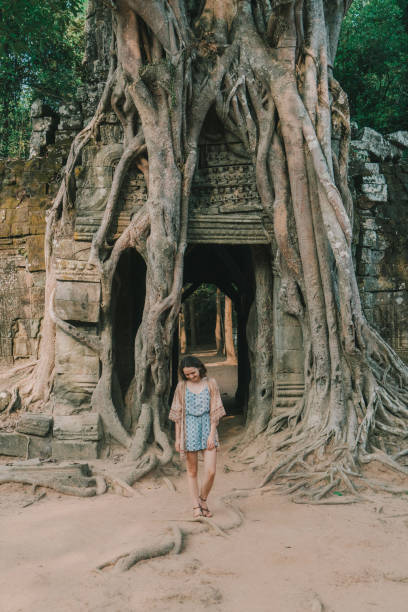 istock Young Caucasian woman   in Angkor  temple 946047732
