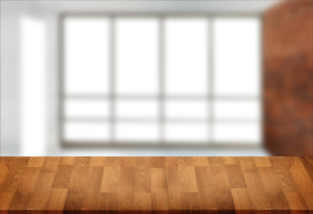 istock Wooden board empty table  window blurred background can be used for display or montage your products and Mock up 946051514