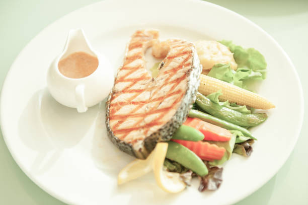 istock Retro Style. Salmon Salad on white plate. 946051576