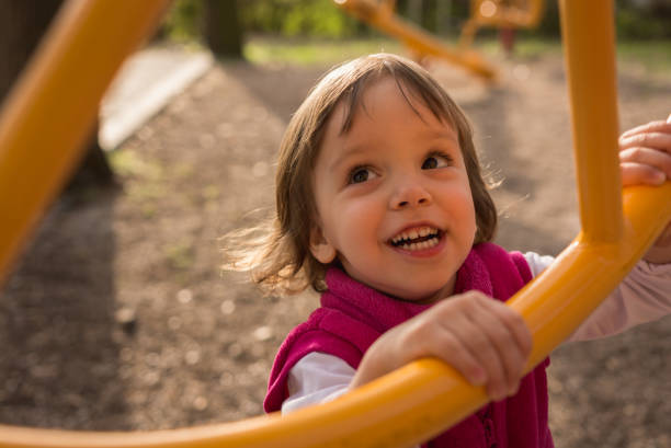 Portrait of beautiful girl at playground. Child, Girls, Caucasian Ethnicity, Children Only jungle gym stock pictures, royalty-free photos & images