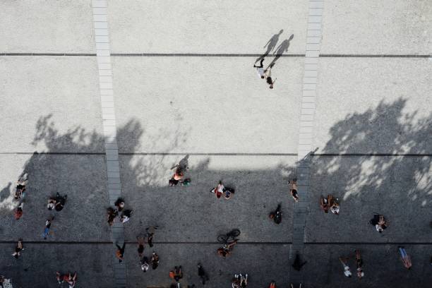istock Directly Above Shot Of People On Footpath 946055556