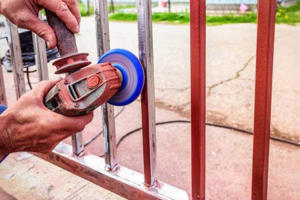 istock removing paint from iron fence with grinder 946061312