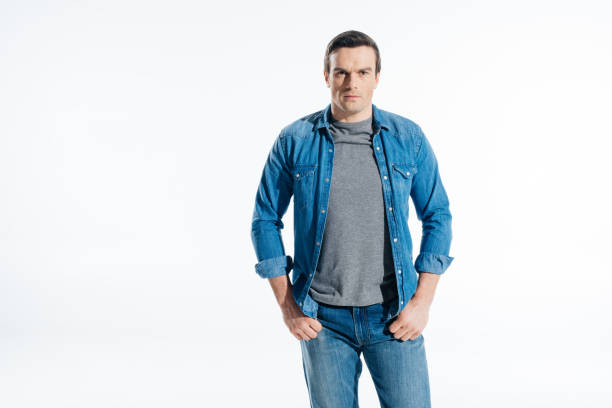 istock Confident handsome man in jeans clothes isolated on white 946063514