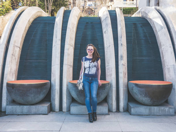 istock City girl posing outdoors looking at camera and smiling 946076266