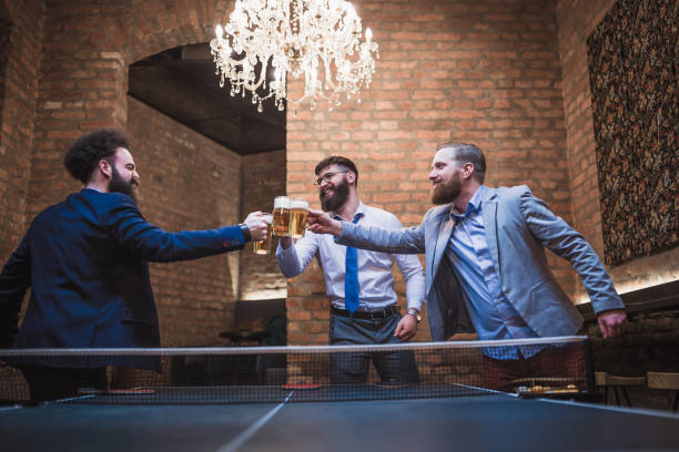 Group of young businessman taking break, having fun after work