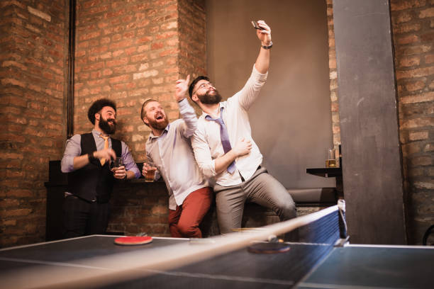 istock Group of young businessman taking break after work, having fun 946078446