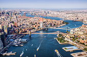 tilt shift Aerial view from Helicopter of BMW bridges. Brooklyn, Manhattan and Williamsburg Bridges. New York