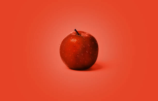 istock Fresh and wet red apples on the red color background 946089678