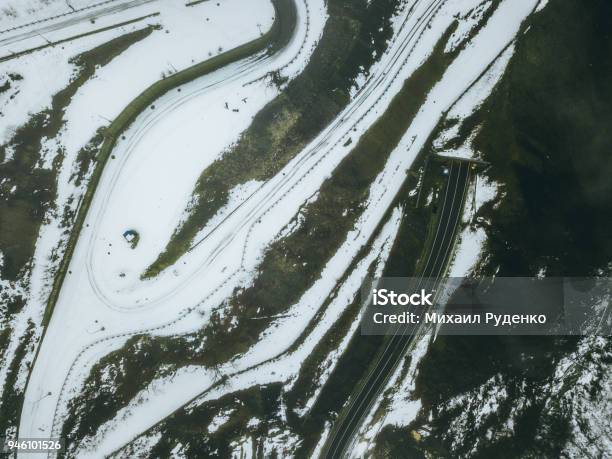 Top Down Winter Snowy Road On The Mountainn Stock Photo - Download Image Now - Mountain, Snow, Above