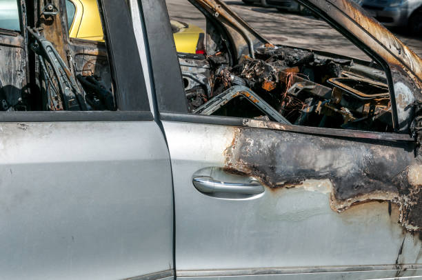 istock Total damage on new expensive burned car in fire on the parking lot, selective focus 946106310