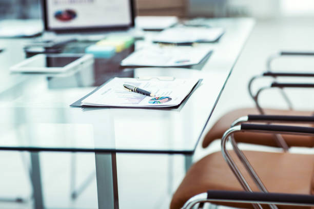 istock workplace with laptop and working documents for the business team in a modern office 946109750