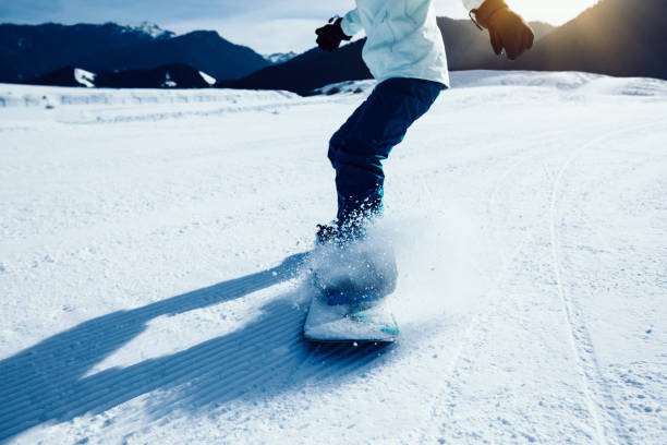 istock one snowboarder snowboarding in winter mountains 946113554