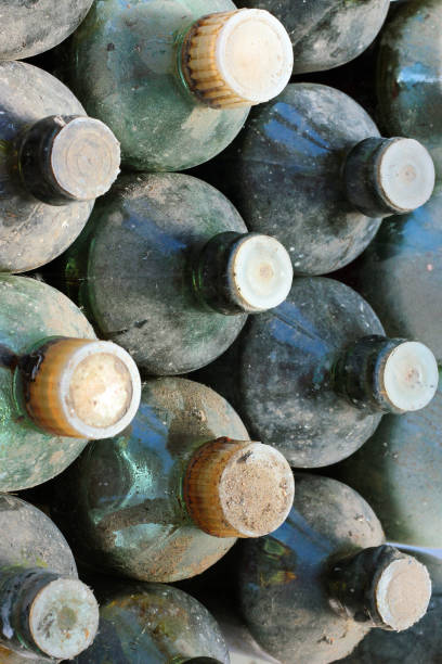 istock Old dusty and dirty glass bottles 946119366