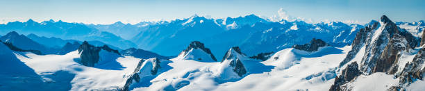 Alps snowy glaciers and rocky peaks mountain panorama France Italy High altitude panoramic view across the bright white glaciers, dramatic rocky pinnacles and high altitude summits of the Mont Blanc Massif and the Vallee Blanche from the Pointe Helbronner, Italy above Chamonix, France. aiguille de midi photos stock pictures, royalty-free photos & images