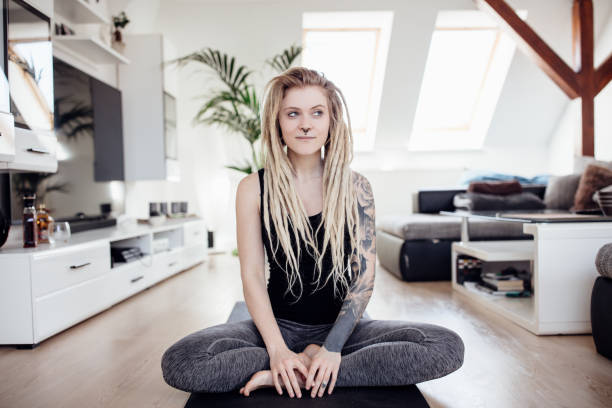 Portrait of young tattooed woman with blond hairs
