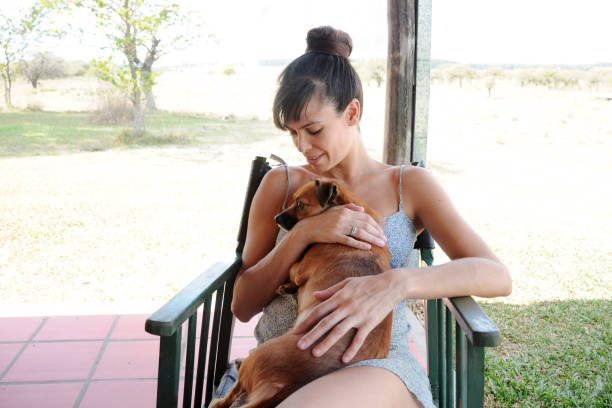 istock woman with pet 946129514