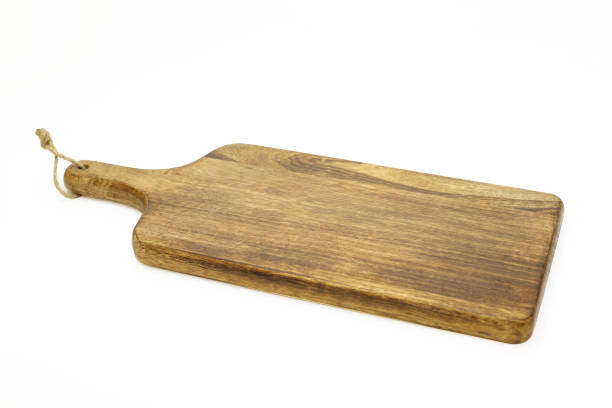 istock wooden cutting board isolated on white 946130036