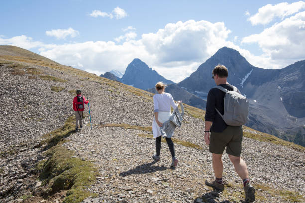 istock Family ascends trail along ridgeline in mountains 946138214