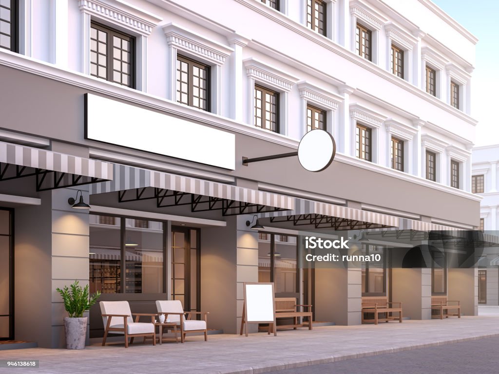 Front of classical style commercial building 3d render Front of classical style commercial building 3d render.There are a street shop, The building has classical style with gray and white color. The shop has white blank sign with clipping path. Store Stock Photo