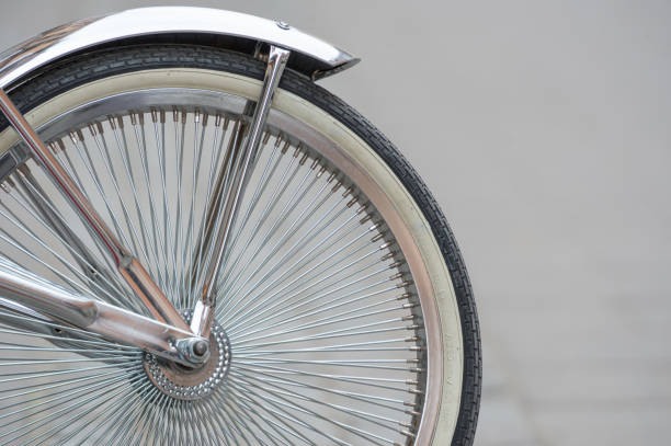 istock Parked bike front wheel on sidewalk 946139444