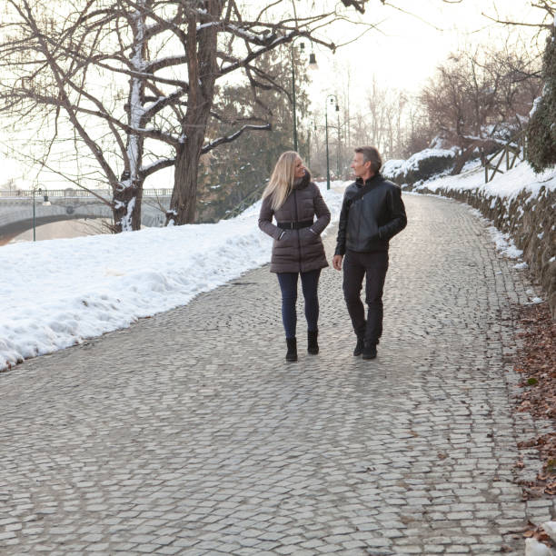 istock Couple explore fresh snow in the city 946145408