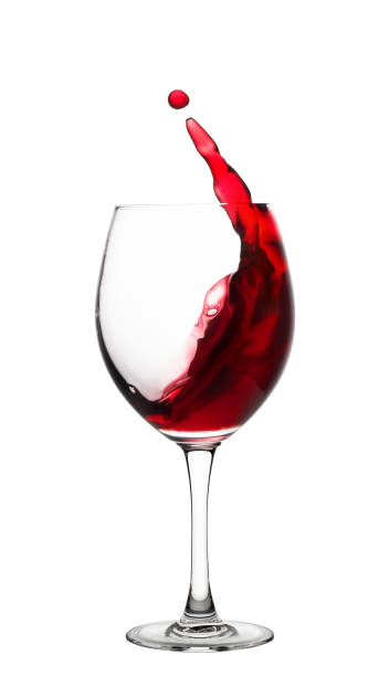 istock Glass with a splash of red wine 946149640