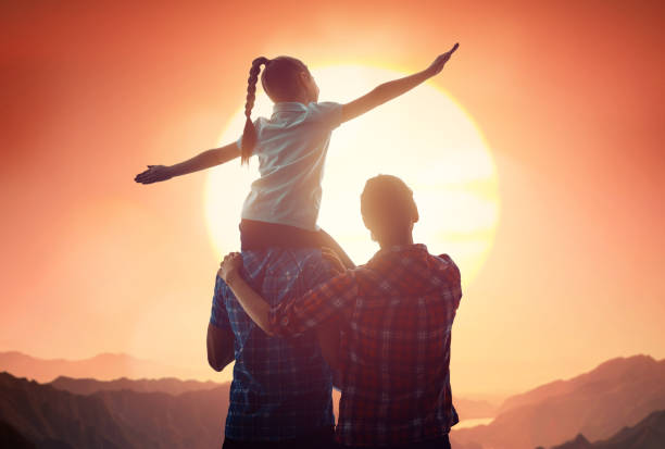 istock family at sunset 946159856