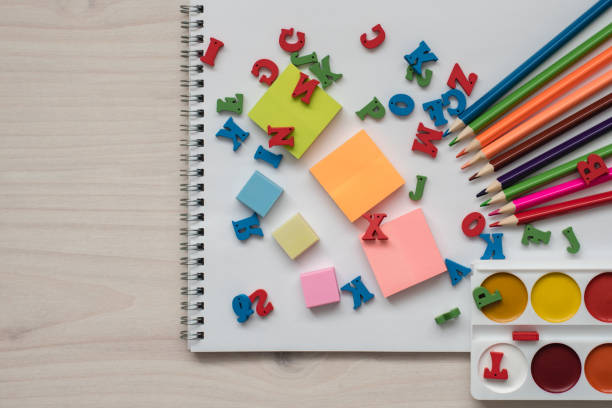 istock School and office tools for drawing on a wooden background 946161158