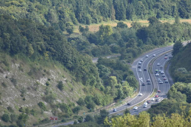 Traffic on the A3 trunk road through the Queen Elizabeth Country Park The park is located near Petersfield in Hampshire. Photo taken from Butser Hill petersfield stock pictures, royalty-free photos & images