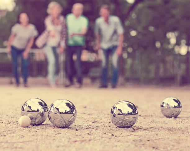 istock people playing petanque at leisure 946164532