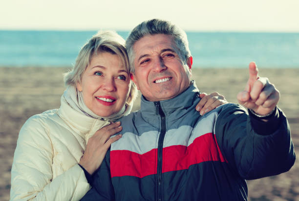 istock Couple walk and husband points to something 946165076