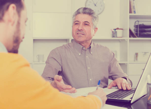 istock Men sign credit agreement 946166456