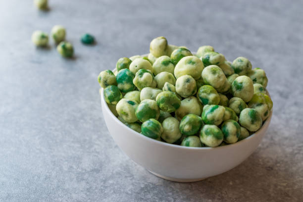 istock Crispy Dry Spiced Green Wasabi Peas as an Appetizer. 946169162