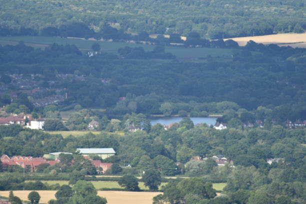 View over Petersfield featuring Heath Pond Photo taken from Butser Hill using maximum optical zoom petersfield stock pictures, royalty-free photos & images