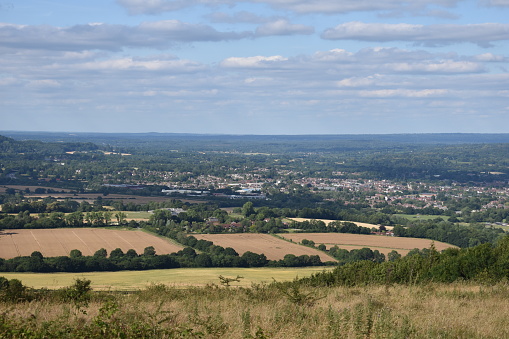 View of horse paddocks at the foot of the North Downs (hills) in Kent, UK