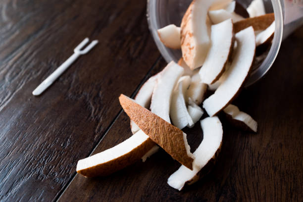 istock Slice of Coconut Pieces in Plastic Cup / Box. 946183108