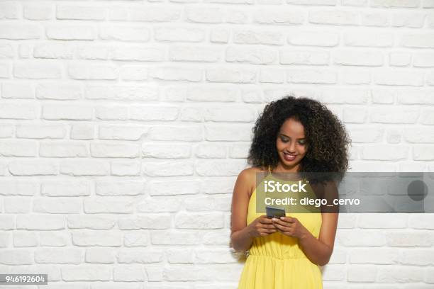 Facial Expressions Of Young Black Woman On Brick Wall Stock Photo - Download Image Now