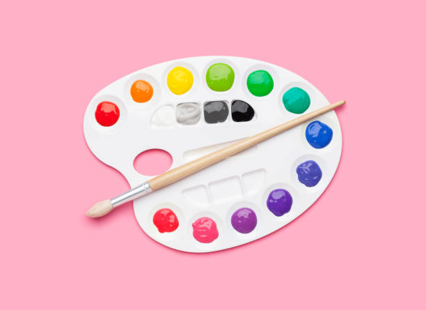 istock Color palette with paint and brush on pink background 946201038