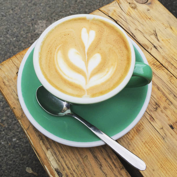 Blue cup of latte coffee
