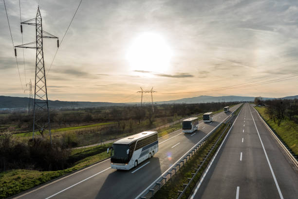 istock Caravan or convoy of busses on highway 946209774