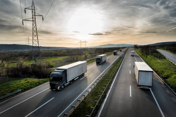istock Caravan or convoy of trucks on highway 946210278