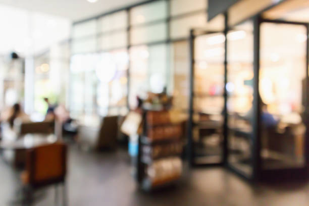 istock Restaurant cafe or coffee shop interior with people abstract defocused blur background 946210614