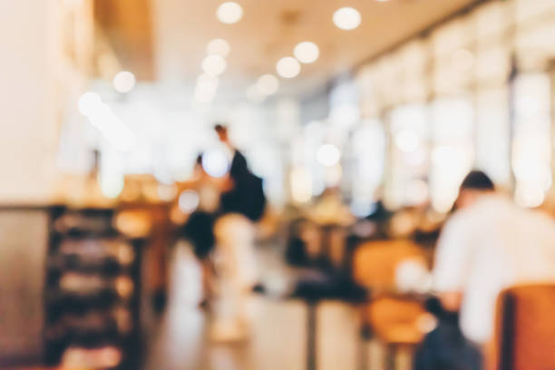 istock Restaurant cafe or coffee shop interior with people abstract defocused blur background 946210632