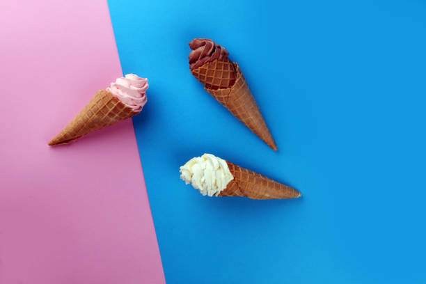 istock Vanilla frozen yogurt or soft ice cream in waffle cone. 946213226