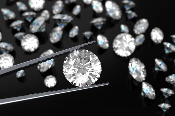 istock 3D rendering Luxury diamonds in tweezers  on black background 946217132