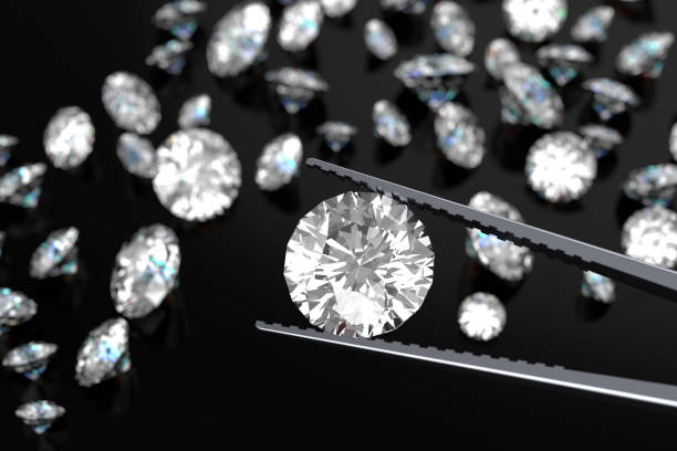 istock 3D rendering Luxury diamonds in tweezers  on black background 946219432