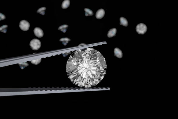 istock 3D rendering Luxury diamonds in tweezers  on black background 946219664