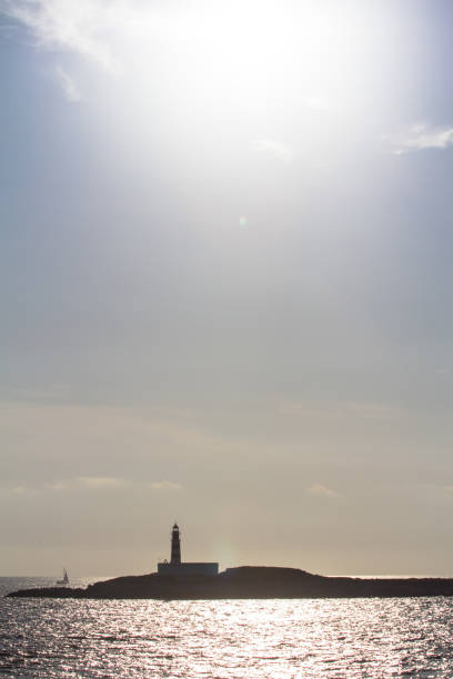 istock Lighthouse in the sea 946233692