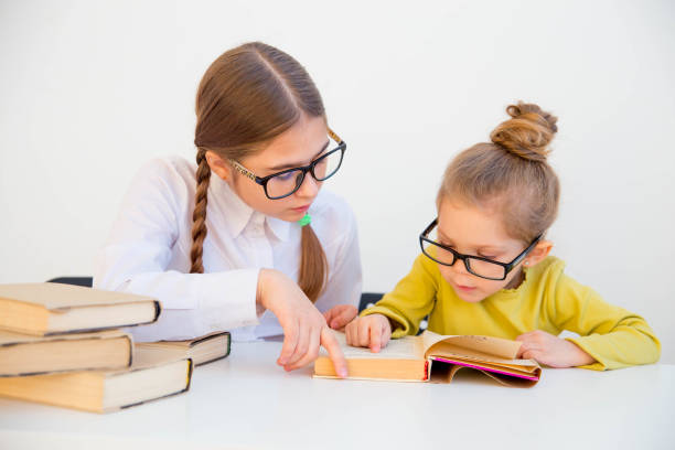 istock kids reading books 946236328