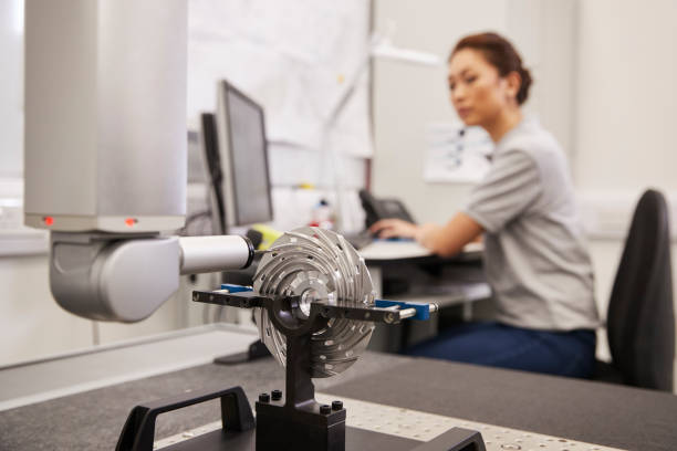 istock Female Engineer Uses CMM Coordinate Measuring Machine In Factory 946237082